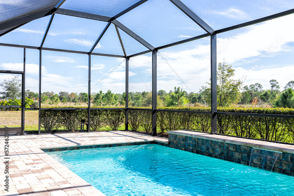 Screened pool enclosure over a coastal Florida pool